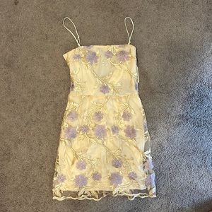 Lucy In the Sky Floral dress with gold details and bow tie back